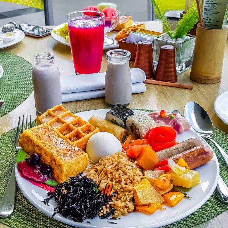 Bali Big Breakfast With All Different Foods Fruit And Cake