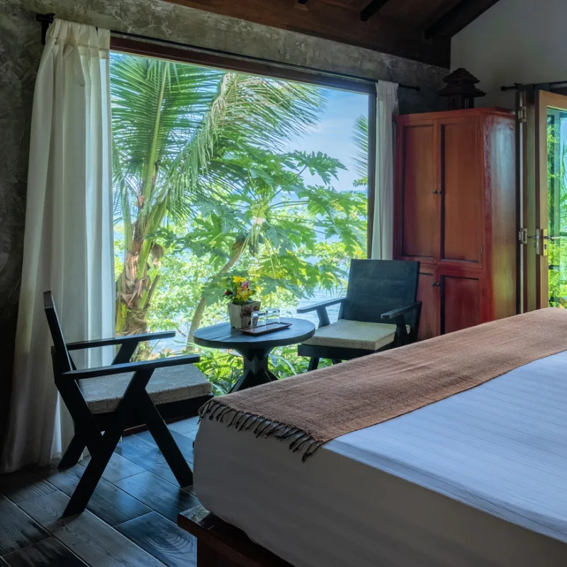 Bedroom-In-Guesthouse-Villa-In-Bali-Overlooking-Palm-Treet-Jungle