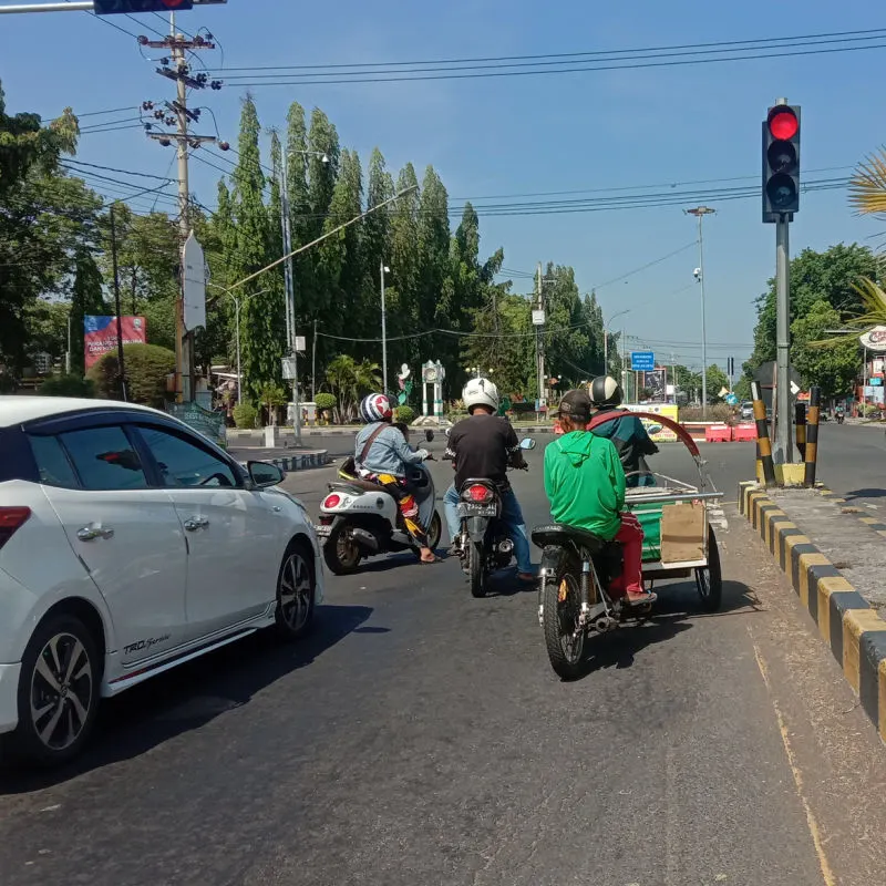 Drivers Wait At Traffic Lights In Bali