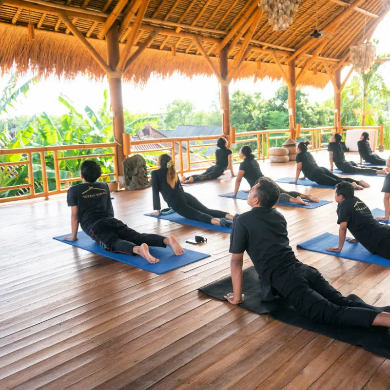 Group-Of-People-All-Wearing-Black-Take-Part-In-Bali-Yoga-Health-Class