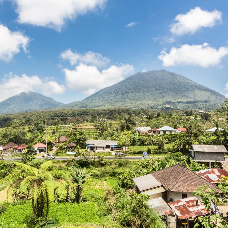 Landscape View Of Rural Bali Countryside Looking Up To Mountains.