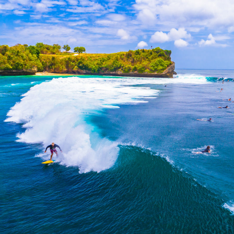 People surfing off Balangan Beach on Bali.