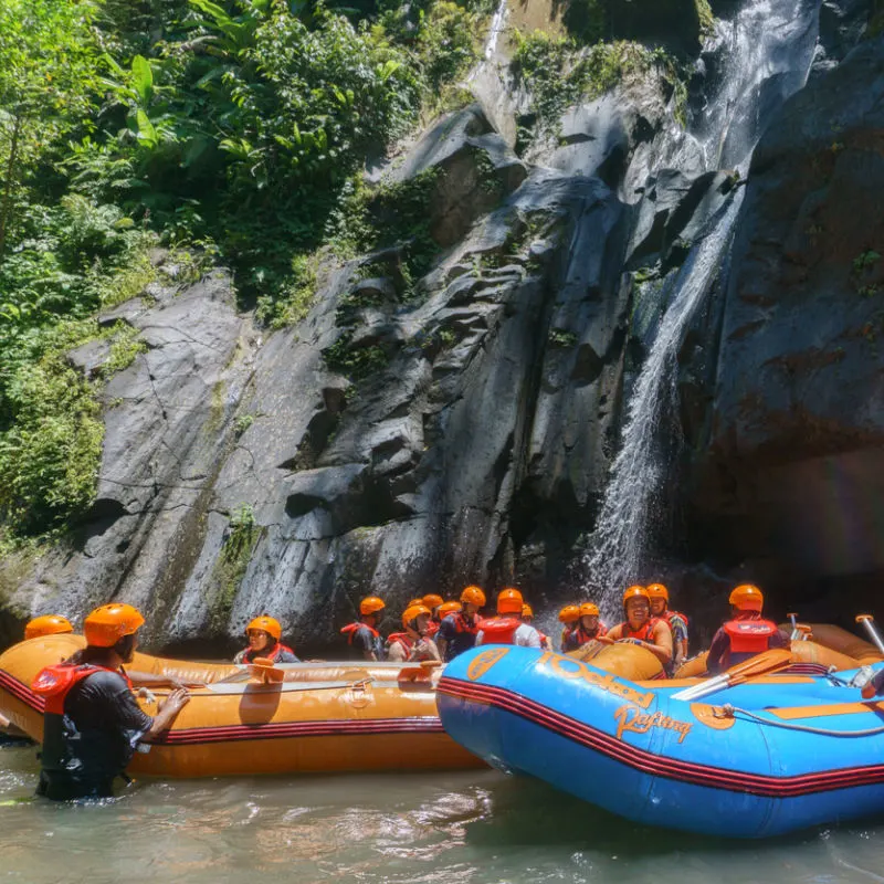 Tourists-Explore-Waterfall-During-Rafting-Adventure-In-Bali