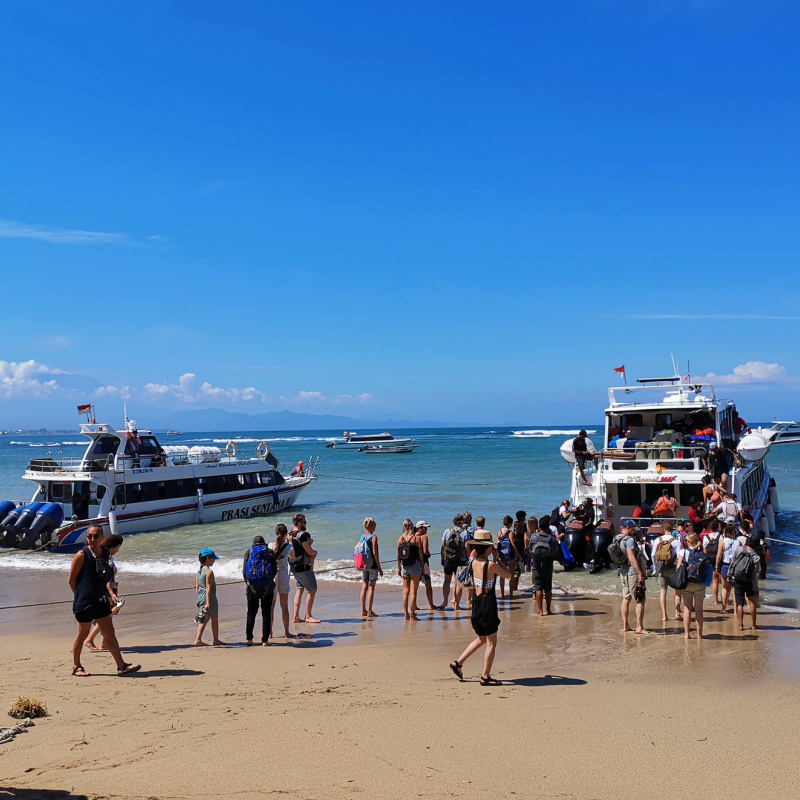 Tourists Get On Board Bali Fast Boat At Sanur