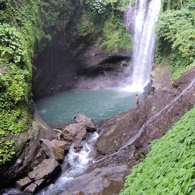 Tourists-Stand-At-the-Bottom-Of-Aling-Aling-Waterfall-in-Bali