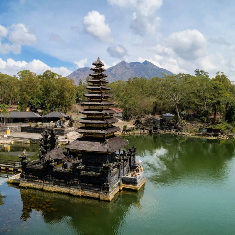 Traditional Balinese Hindu temple At Edge Of Lake batur With View of Mount Batur In Bali