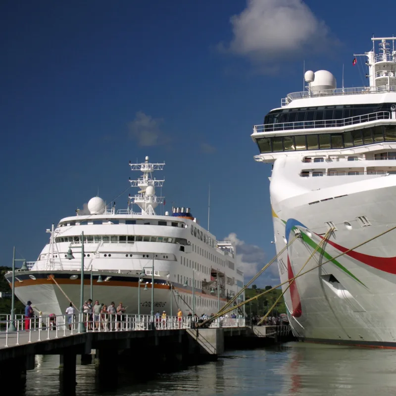 Two-Small-Cruise-Ships-Dock-At-Harbor-Port