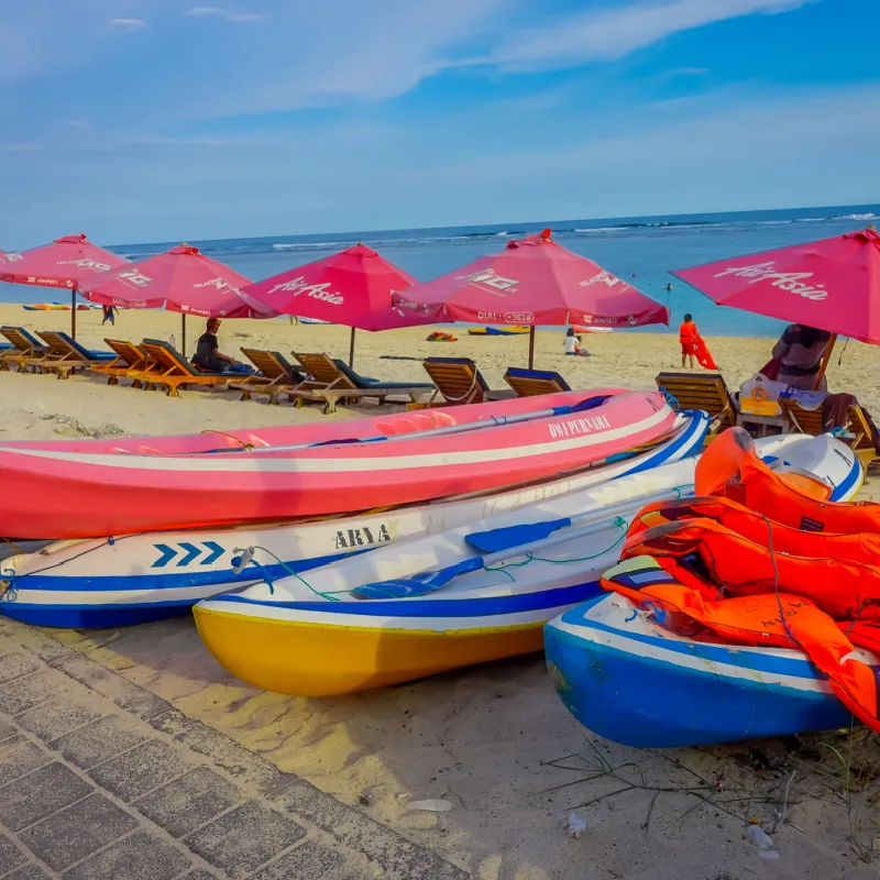 Canoes-And-Sun-Umbrellas-On-Bali-Beach-Panati-Pandawa