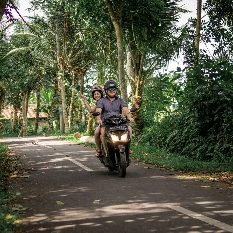 Couple Ride Moped In Rural Bali.jpg