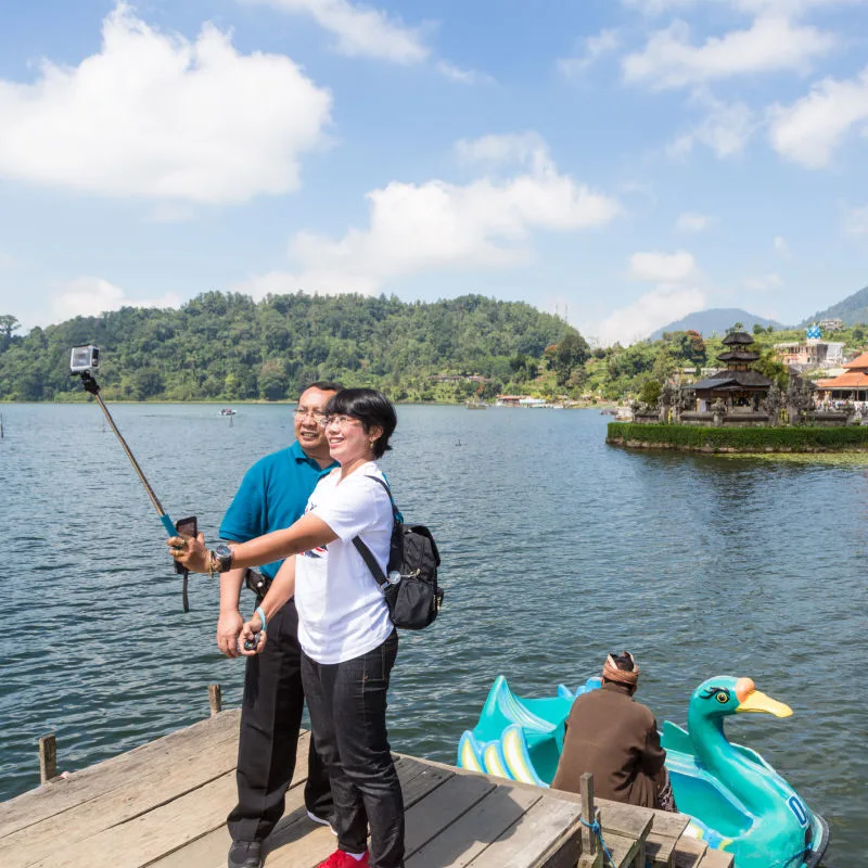 Couple Take A Selfie By Bali Lake
