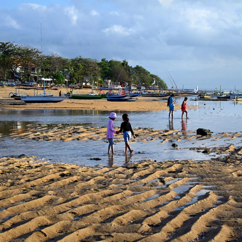 Families Play On Sanur Beach In Bali