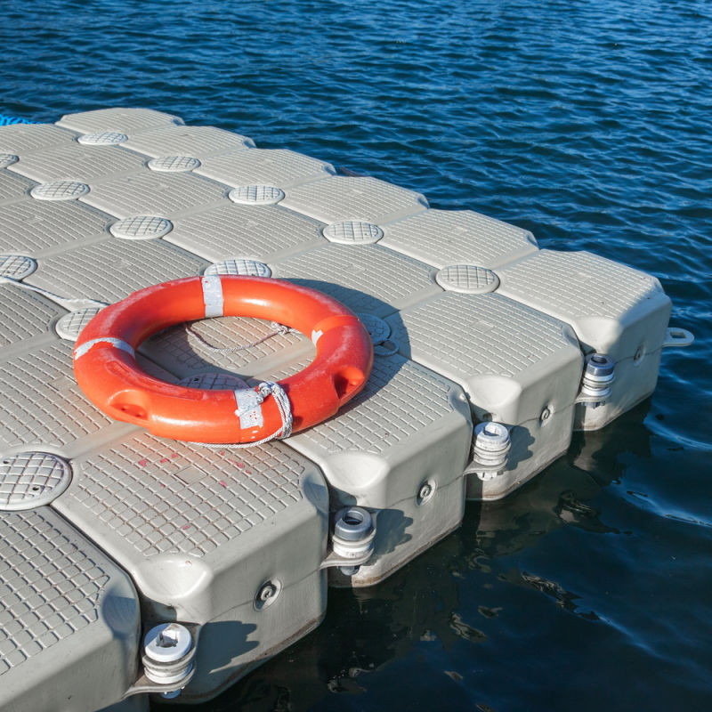 Floating Pontoon Dock And Life Ring On Sea