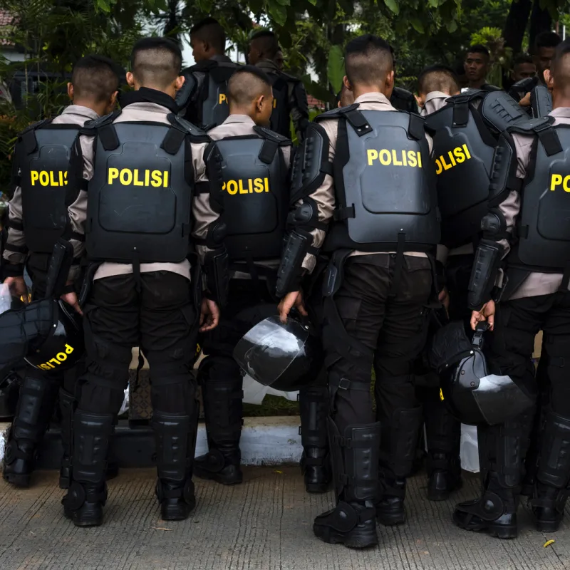 Police-In-Indonesia-Put-On-Protective-Equipment