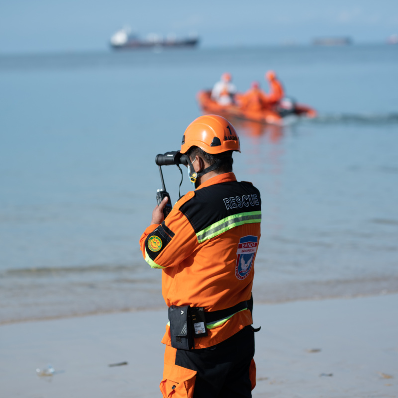Search and Rescue Officer Stands On Beac
