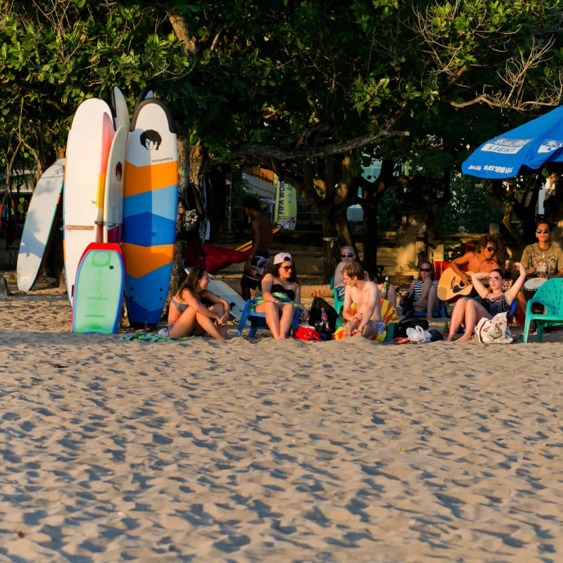 Tourists-Relax-On-Kuta-Beach-In-Bali