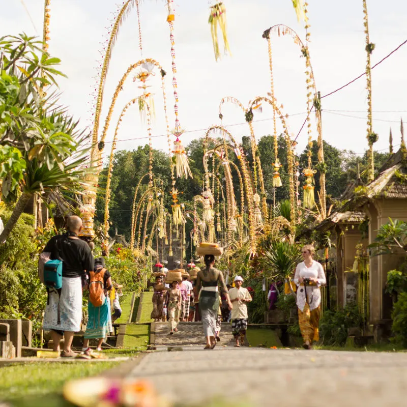 Tourists Visit Traditional Bali Village