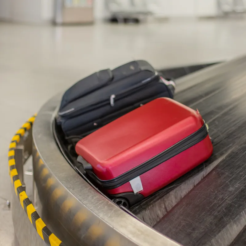 Bags on Luggage Carousel At Airport.