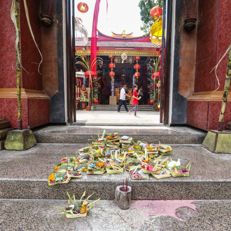 Canang Sari offerings outside Chinese Buddhist Temple in Bali