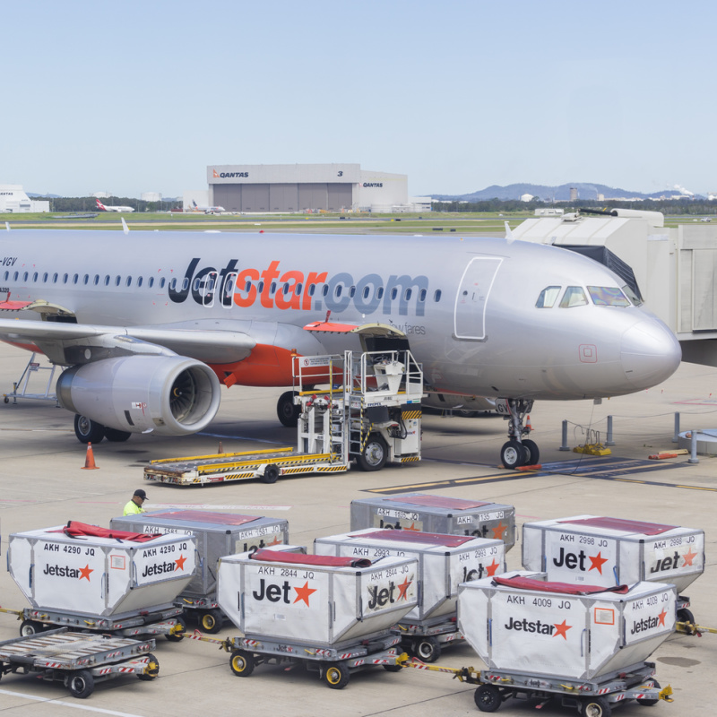 Jetstar With Luggage Trolley Carts Waiting To Be Loaded