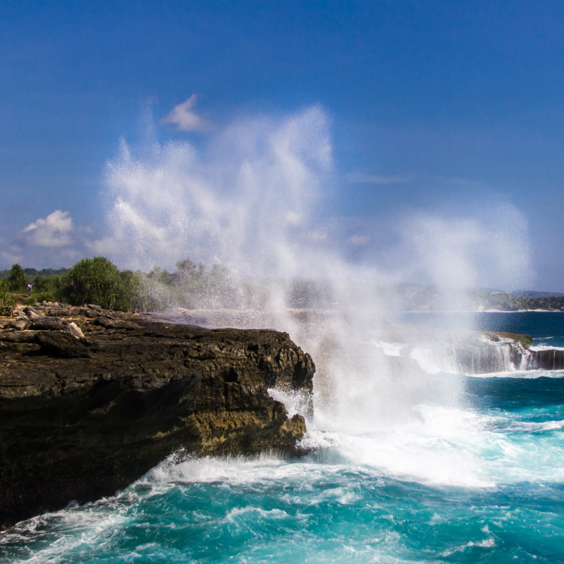 Waves From The Sea Hit Rocks And Cliffs at Nusa Lembongan Island Off Bali.