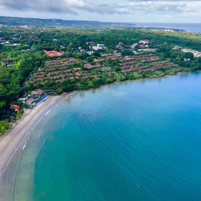 Ariel-View-Of-Jimbaran-Coastline-and-Village-Resorts-in-Bali