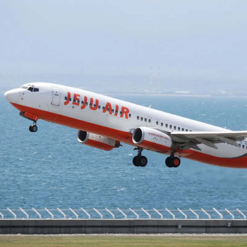 Jeju Air plane takes off from airport near ocean