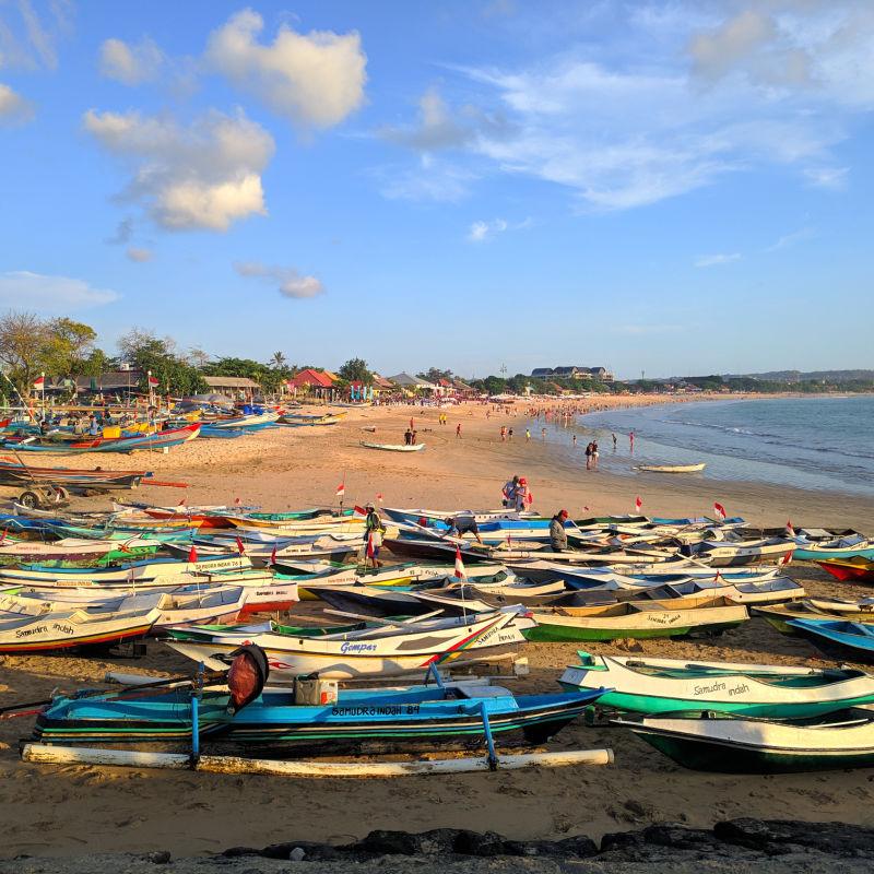 boats along a beach in bali