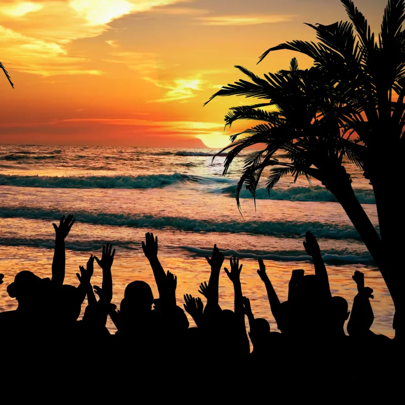 People-On-Beach-Having-Party-At-Sunset