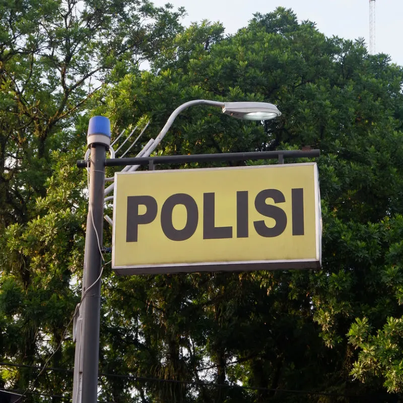 Police Sign On Lamppost in Bali