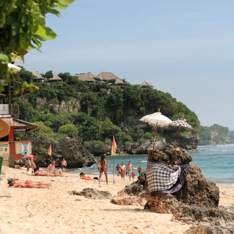 Tourists-Relax-on-Bingin-Beach-Uluwatu-Bali