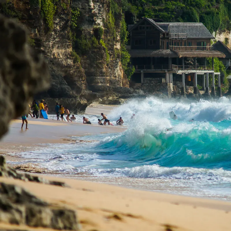 Tourists Run Away From Dangerous Waves Weather Storm At Dreamland Beach in Bali.jpg