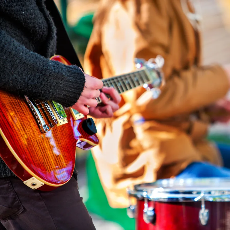 Close-Up-Of-Guitar-and-Drum-Music-Live