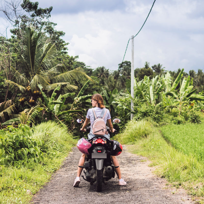 Tourist-On-Moped-On-Farm-Track-in-Bali