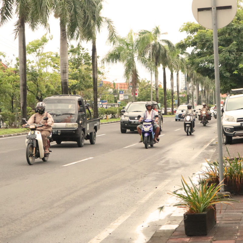Jalan Sunset Road in Bali Traffic Car Moped