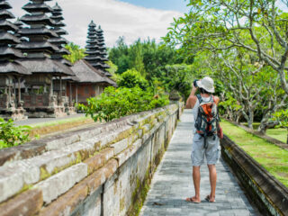 Tourist Takes Photo Of Bali Temple