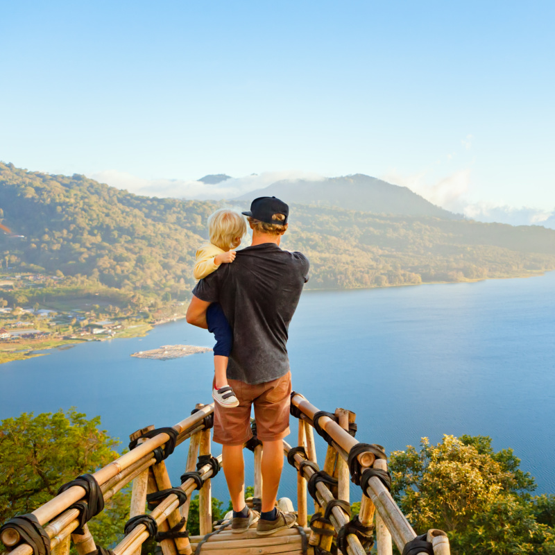 Tourist Family Look Over Twin Lakes Tamblingan Buyan in North Bali Buleleng.jpg