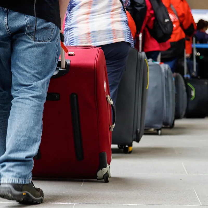 Tourists-Line-Up-At-Airport