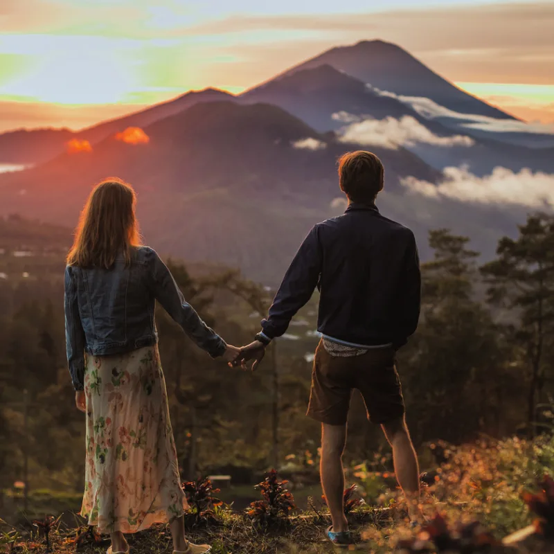 Couple-Look-Over-Mount-Agung-From-Mount-Batur-In-Bali