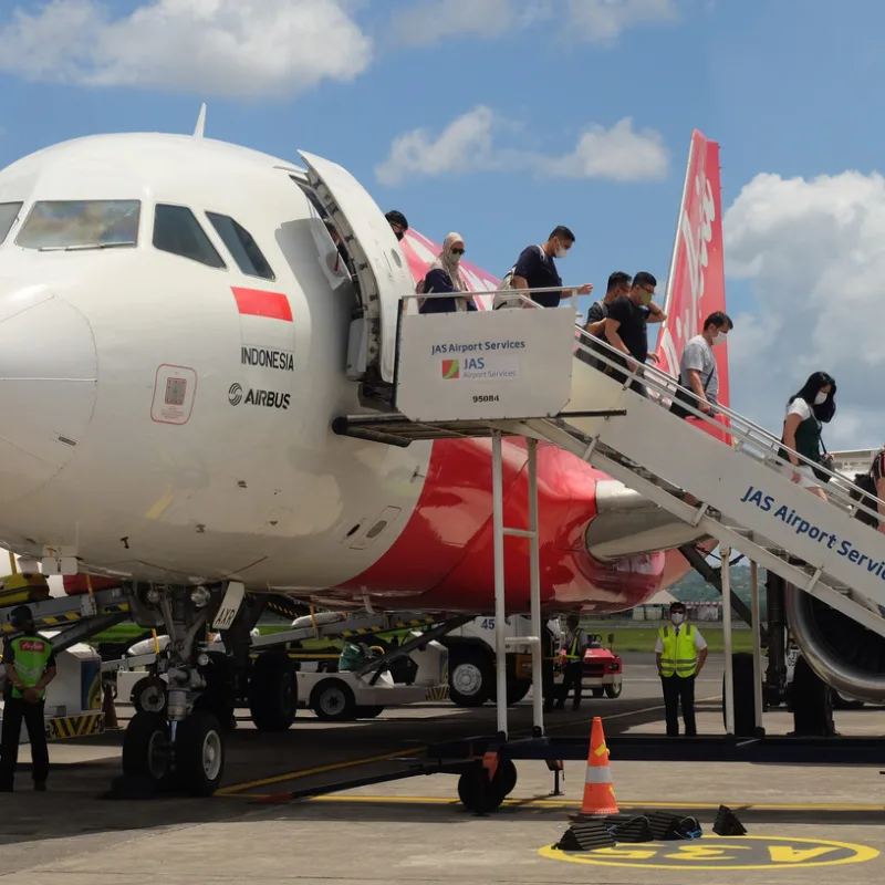 Travelers Get Off Plane