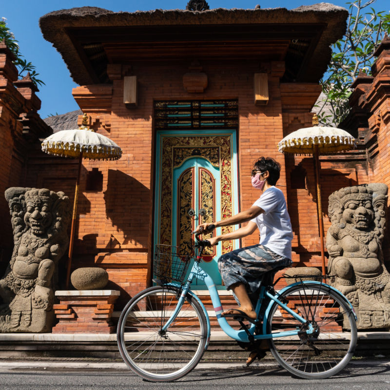 Tourist-Rides-Bike-in-Ubud
