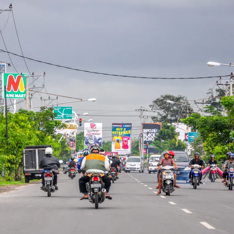 Busy Road in Bali With Mopeds and Cars Traffic.jpg