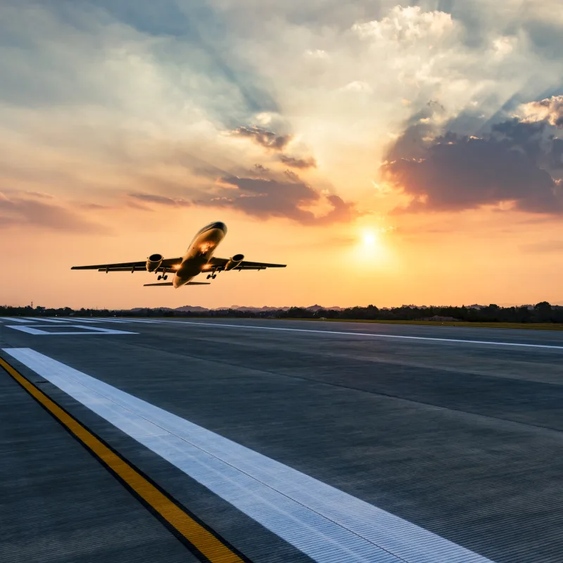 Airplane Takes Off At Sunset.jpg