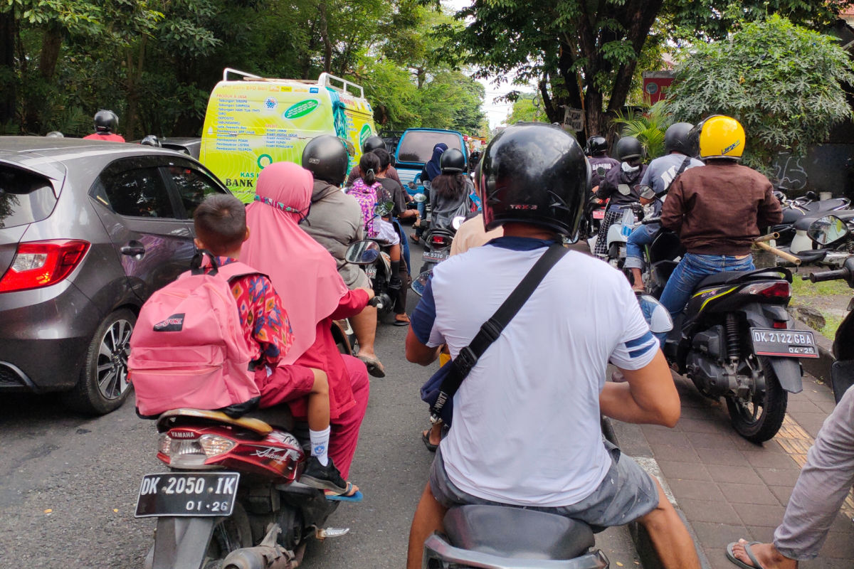 Moped Drivers sit In Traffic Jam On Bali Road in Daytime.jpg