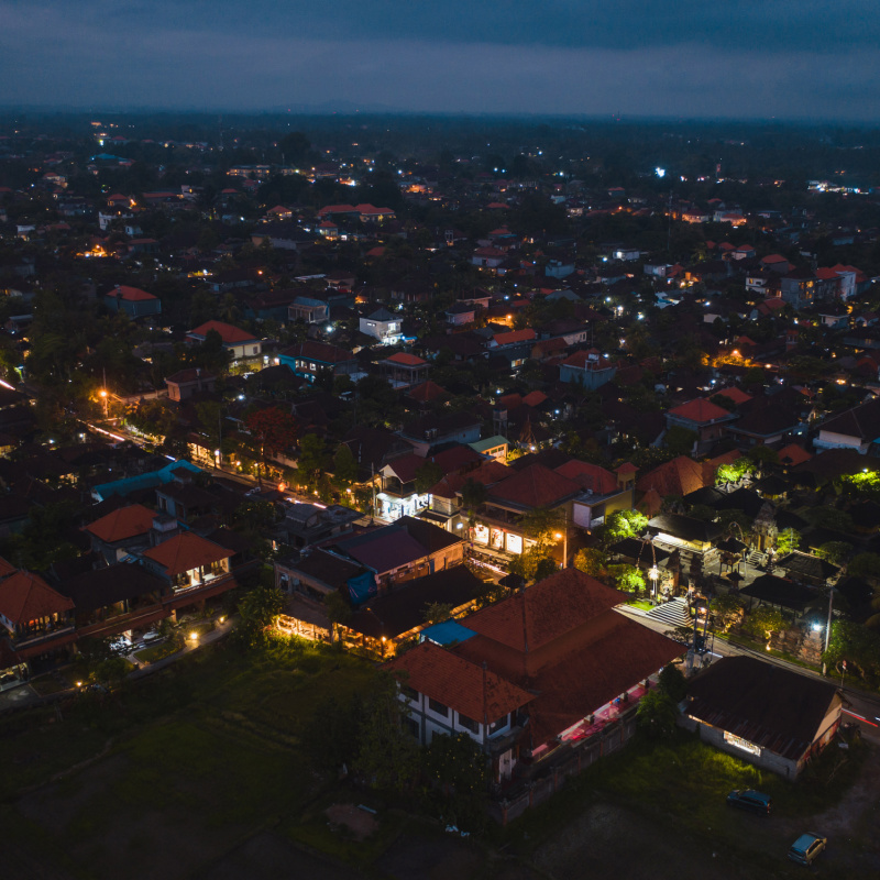 Ubud-At-Night-Lights-Are-Birght-in-The-Bali-Tourist-Town-Landscape-Airel-View