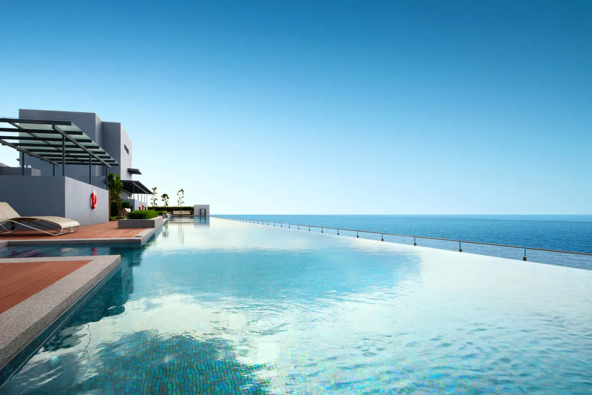 Long infinity pool overlooks ocean from rooftop.jpg