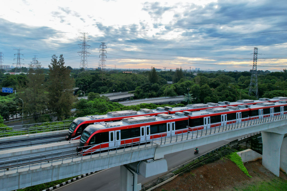 Jakarta Metro Trains By Trees In Daytime.jpg