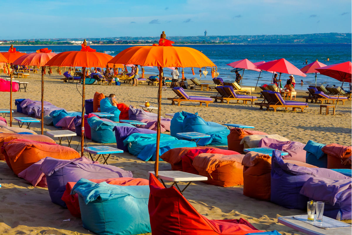 Empty Colourful Sun Loungers At Seminyak Beach in Bali.jpg