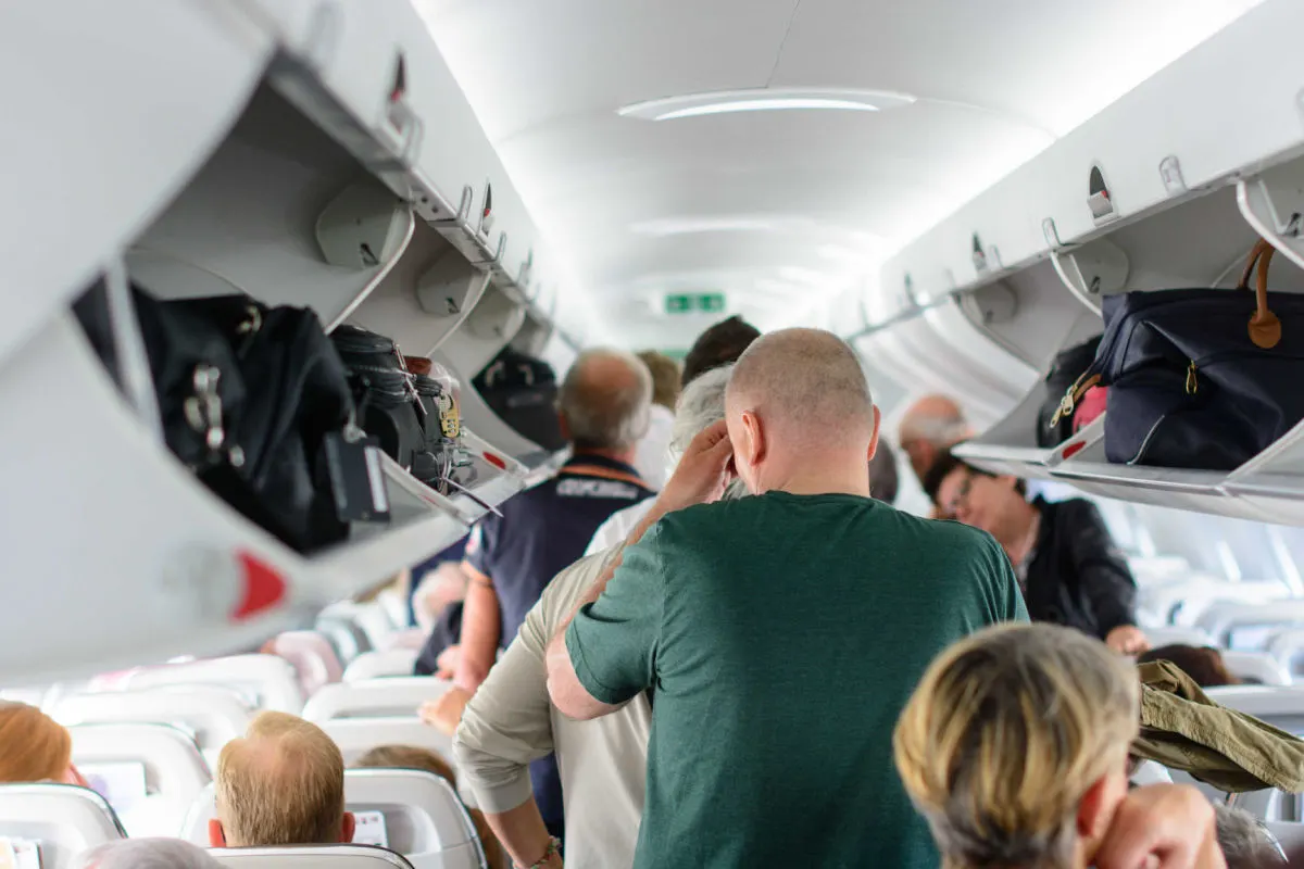Passengers get off a plane.jpg
