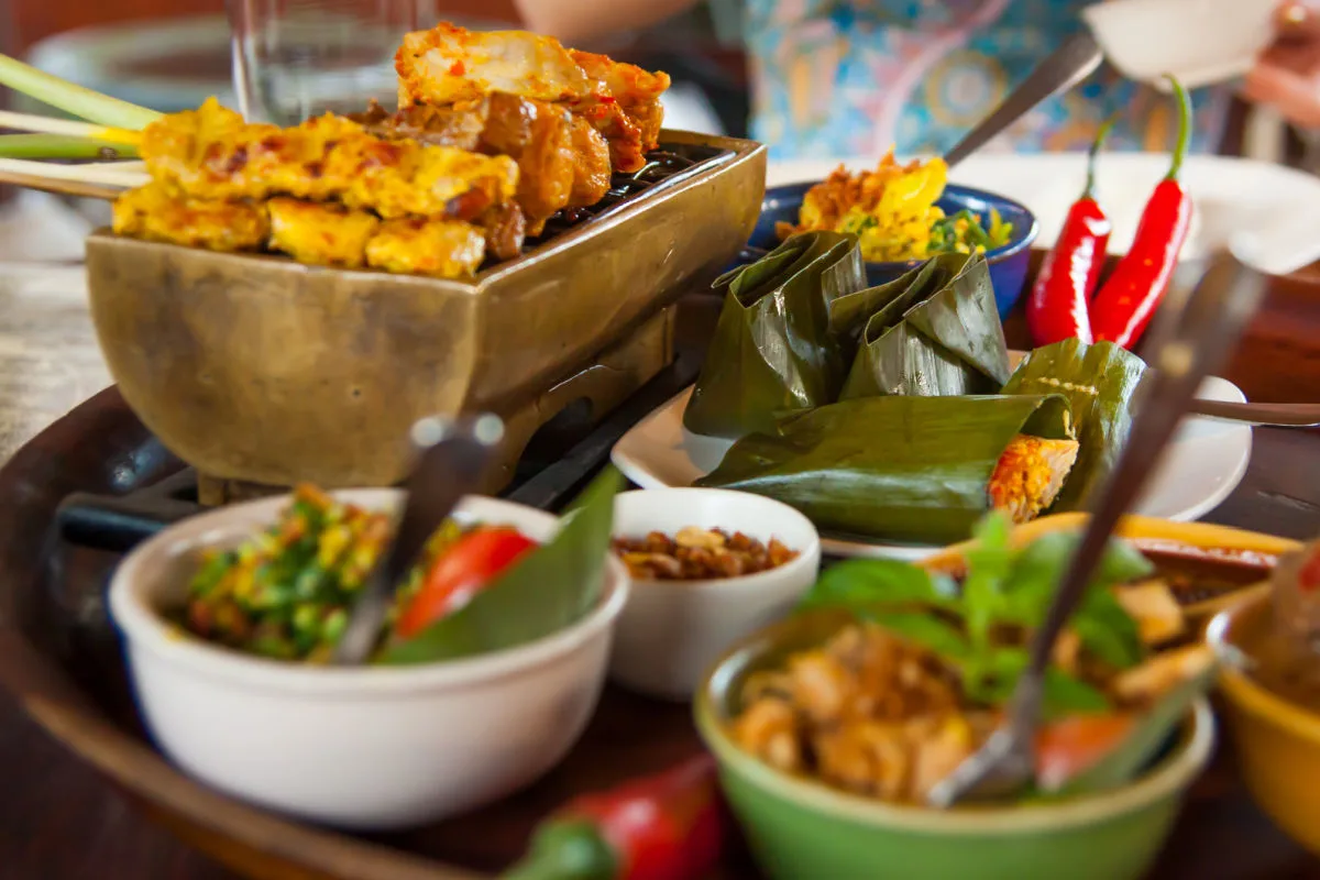 Balinese Satay plates of food on a table.jpg