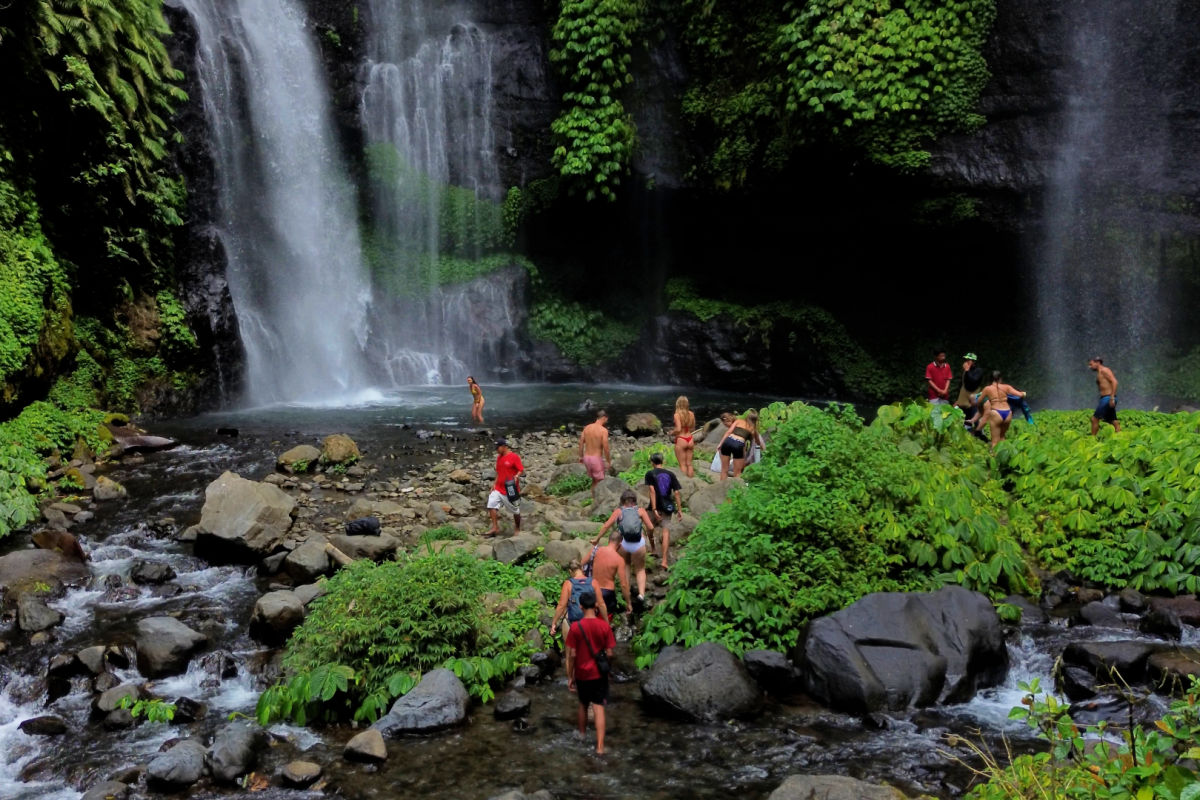 Tourists explore Sekumpul Waterfall in North Bali Buleleng.jpg